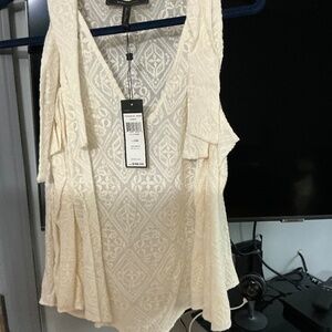 Bcbg ivory lace top with ties at shoulder.  Original tags included.